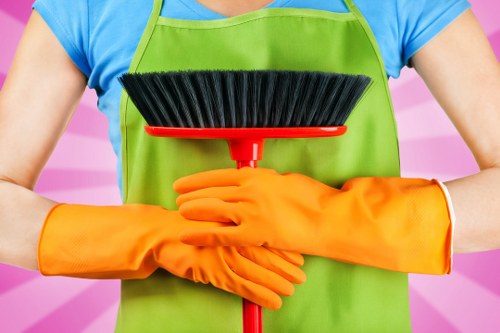 Deep cleaning kitchen cabinets and counters during move in cleaning